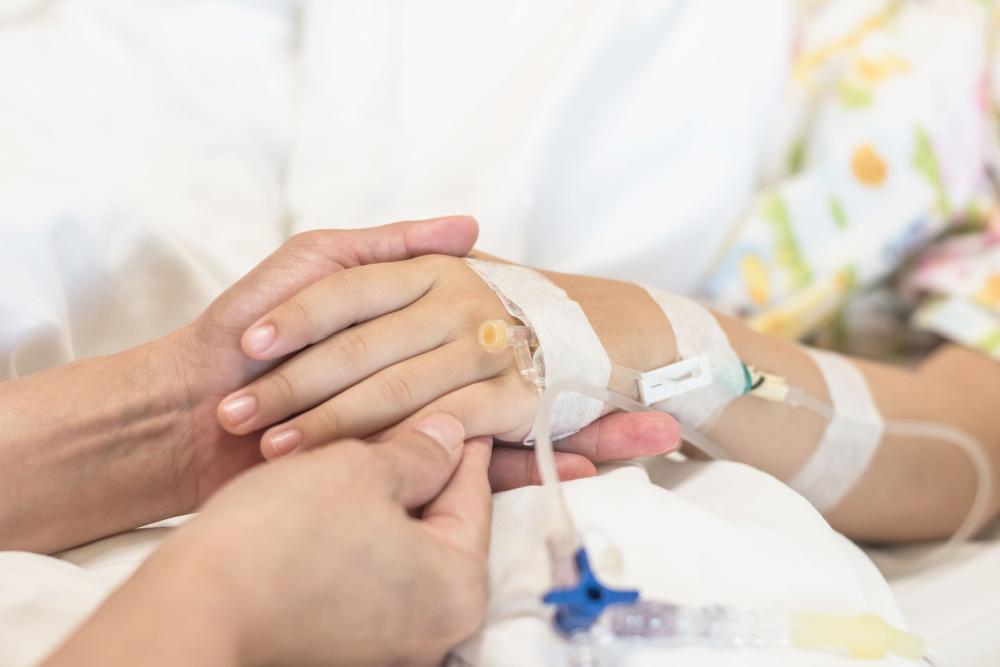 Nurse caretaker hand support taking care of child patient